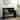 Black Wood Storage Bench with Scrolled Armrests