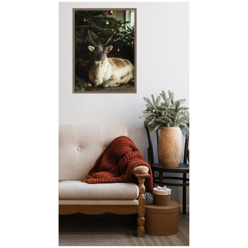 Kate and Laurel Sylvie Framed Canvas Reindeer Sitting Under a Christmas Tree by Michael Schauer