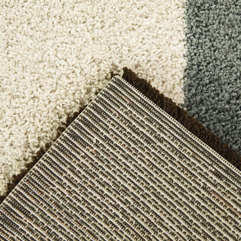 Leucon Assymetrical Border Area Rug