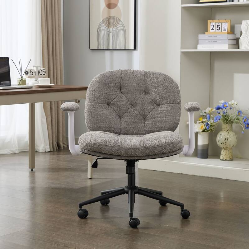 Grey Swivel Chair with Flip-Up Armrests and Crossed Legs