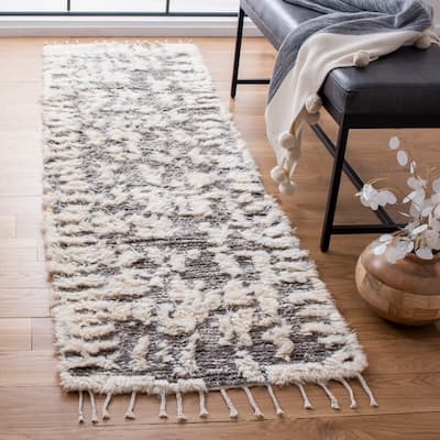 SAFAVIEH Hand-Knotted Manhattan Florije Wool Tassel Rug