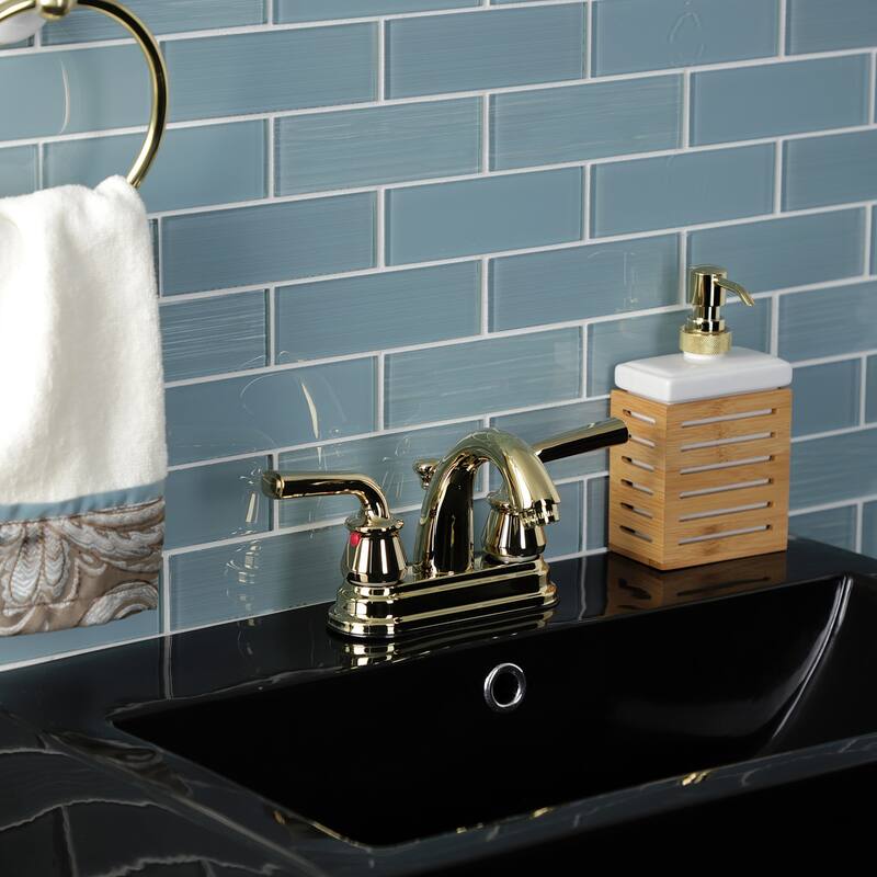 Kingston Brass Restoration Two-Handle 3-Hole Deck Mount 4" Centerset Bathroom Faucet with Plastic Pop-Up