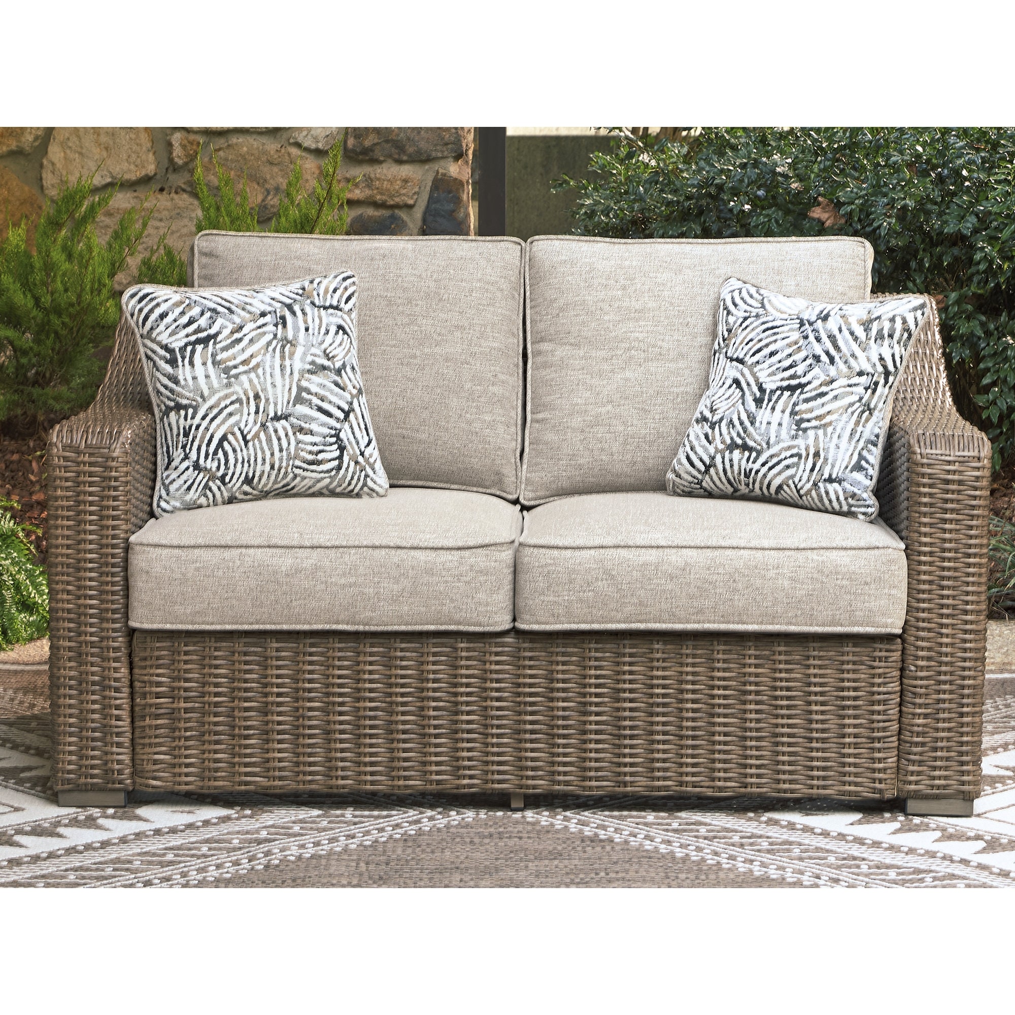 Signature Design by Ashley Carmel Bay Beige/Gray Outdoor Loveseat with Cushion