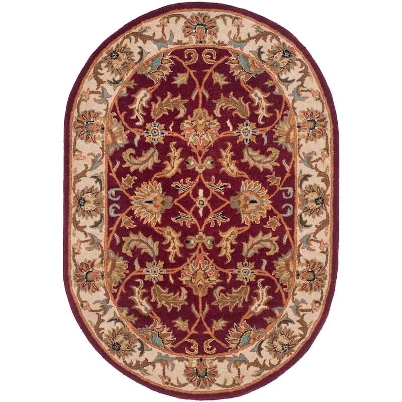 SAFAVIEH Handmade Heritage Lion Traditional Oriental Wool Rug - 4'6" x 6'6" Oval - Red/Ivory