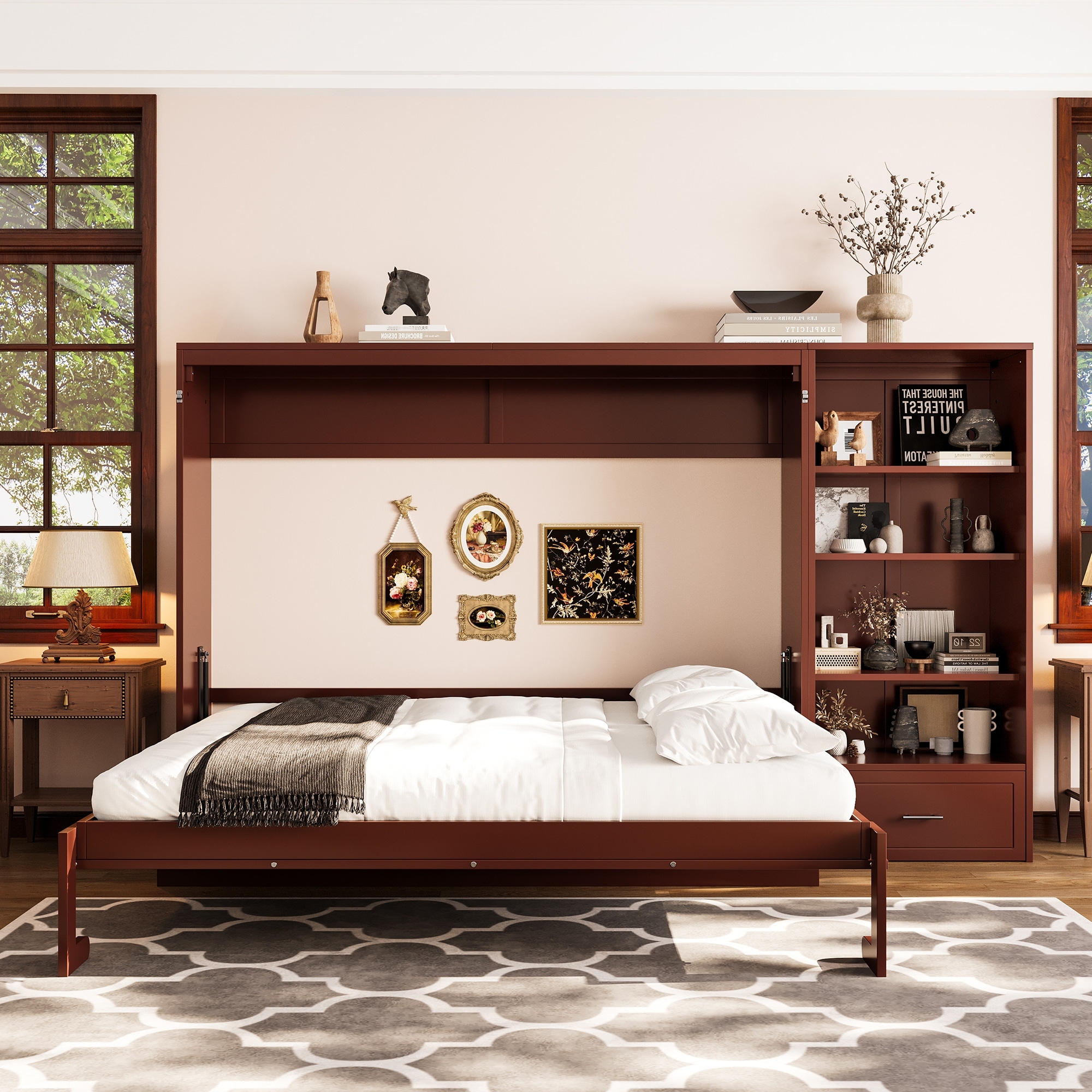 A brown wood-constructed wall bed unit with a pull-down bed and built-in shelves on right, featuring decorative items on top and a side cabinet. The bed is lowered revealing a white mattress with white bedding, a gray blanket, and framed wall art behind.