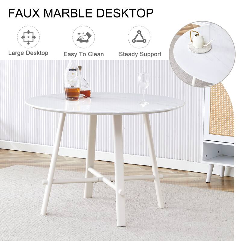 A Modern Minimalist Circular Dining Table With A 42 Inch Diameter White Patterned Tabletop And White Metal Legs