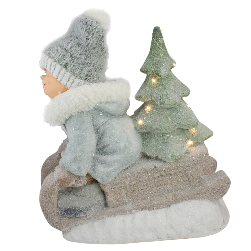 15" Beige and Green Lighted Boy on a Sled Christmas Decoration