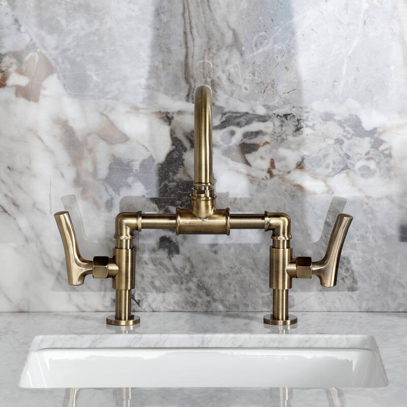 Kingston Brass Hallerbos Two-Handle 4-Hole Deck Mount Bridge Bathroom Faucet with Brass Pop-Up Drain
