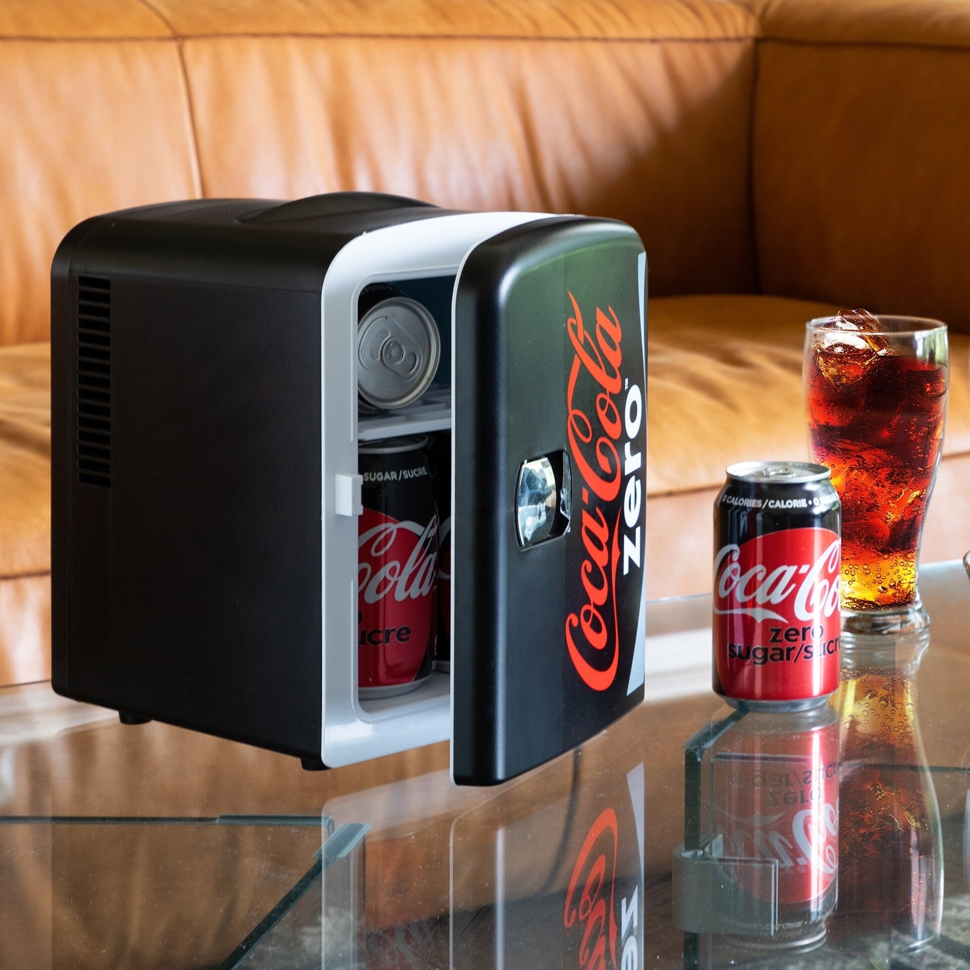 https://ak1.ostkcdn.com/images/products/is/images/direct/103df77a968f3b92de126c0b8ef3c9f0fd81f6bb/Coca-Cola-Fanta-Mini-Fridge-6-Can-AC-DC-Cooler-Warmer.jpg