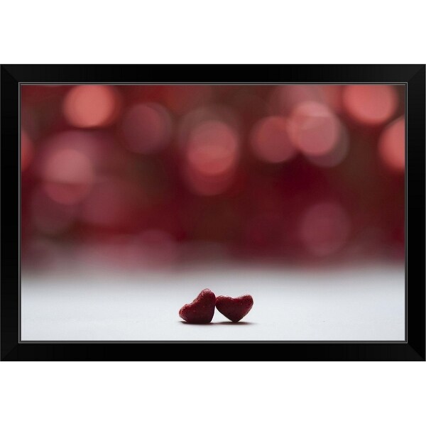 "Two red hearts and red bokeh background" Black Framed Print