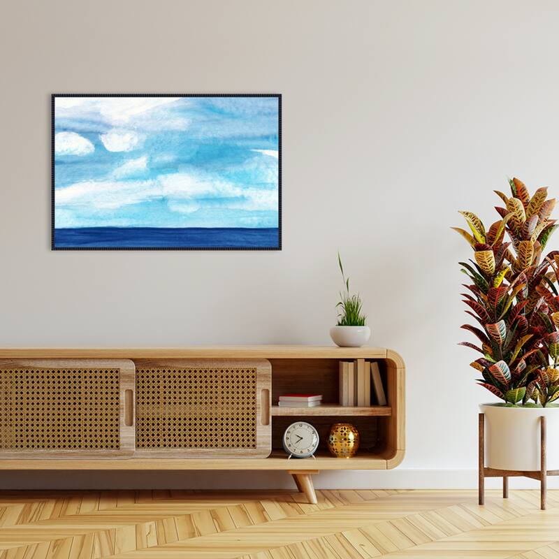 Tranquil Blue Ocean with Cloudy Skies by Danushka Abeygoda Framed Canvas Wall Art Print