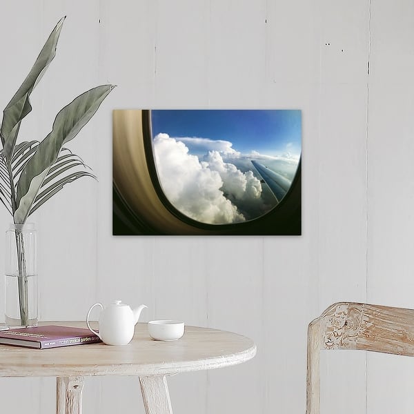 Shop Watching The Clouds Pass By Through A Window Of An Airplane