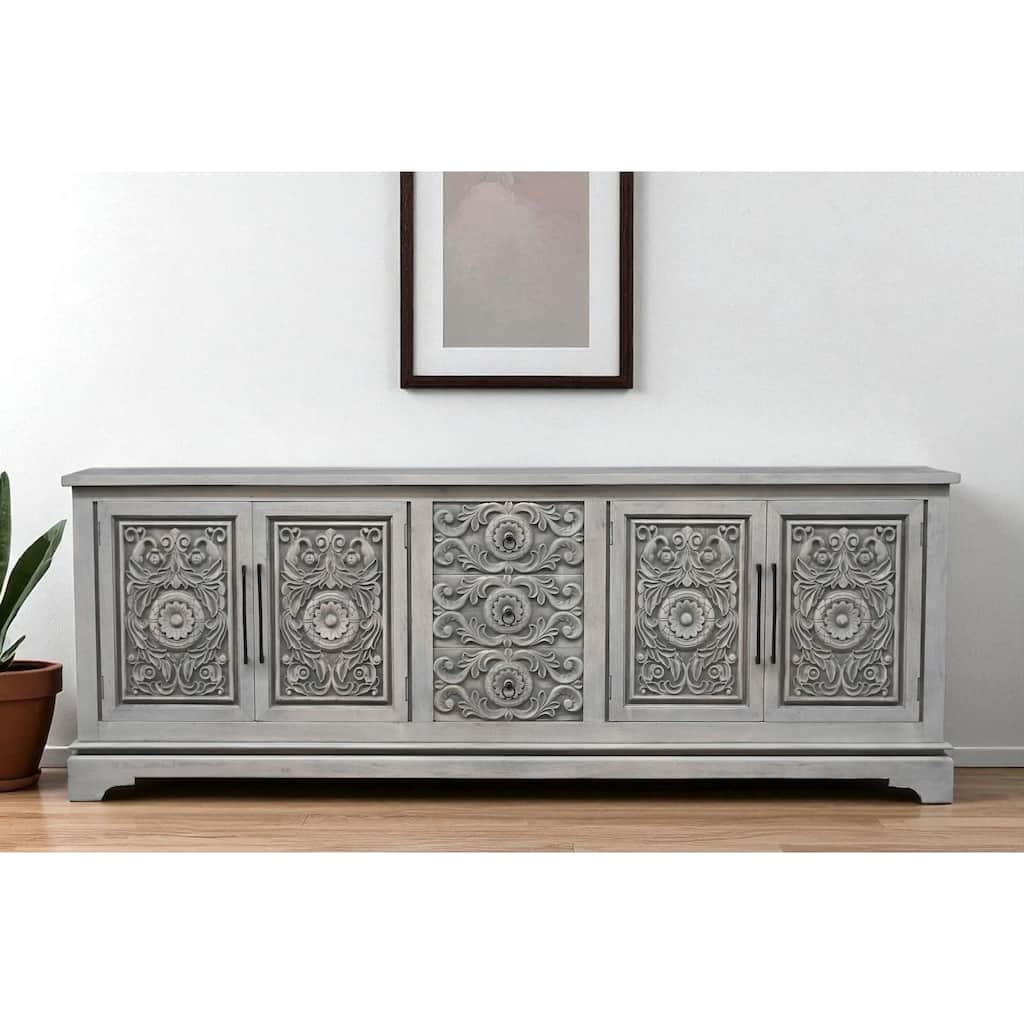HomeRoots 106" Gray Distressed Solid Wood Carved Floral Three Drawer Sideboard with Four Doors