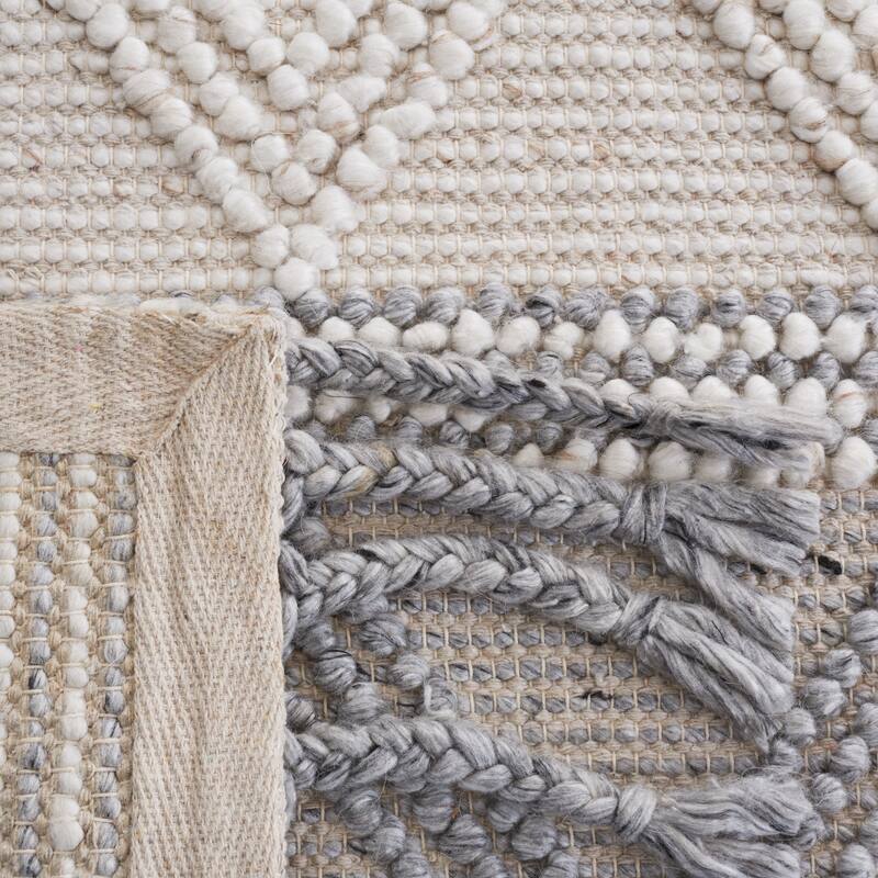 SAFAVIEH Handmade Natura Gerdje Wool Braided Tassel Rug