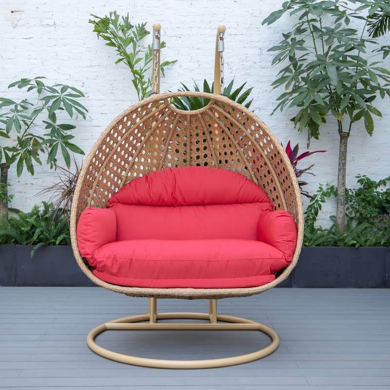 LeisureMod Mendoza 2-Person Hanging Egg Swing Chair - Handcrafted Light Brown Wicker, Patio Hammock Lounger with Cushions - 53"