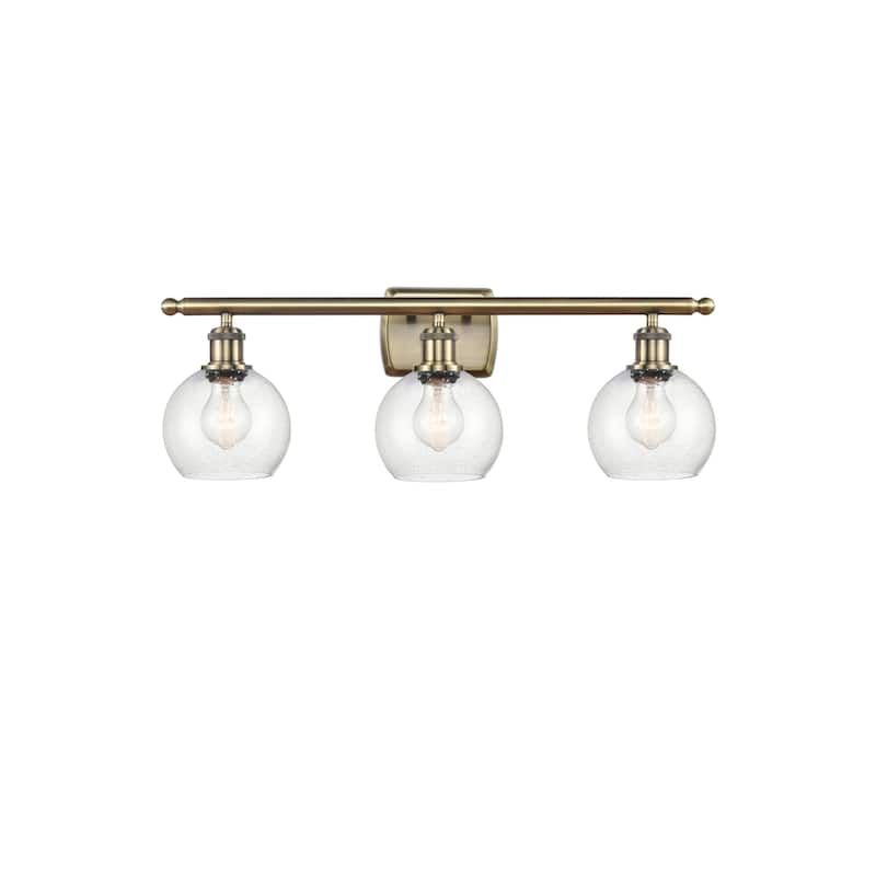 Innovations Lighting 516-3W-10-26 Athens Vanity Athens 3 Light 26" - Antique Brass / Seedy