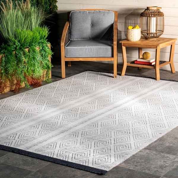 The Curated Nomad Frida Indoor/ Outdoor Geometric Striped Tassels Area Rug. Opens flyout.
