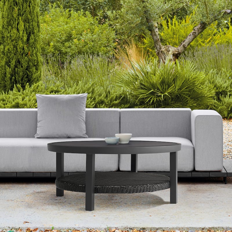 Grand Black Aluminum Slat Top Round Outdoor Coffee Table with Wicker Shelf - Black