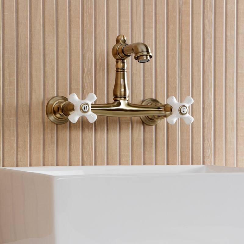 Kingston Brass English Country Two-Handle 2-Hole Wall Mount Bathroom Faucet