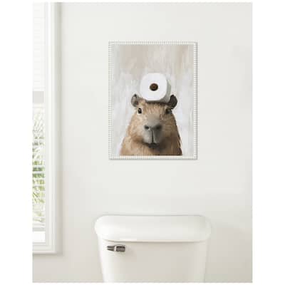 Kate and Laurel Sylvie Toilet Paper Roll on Cute Capybara Head Bathroom Art Framed Canvas by The Creative Bunch Studio