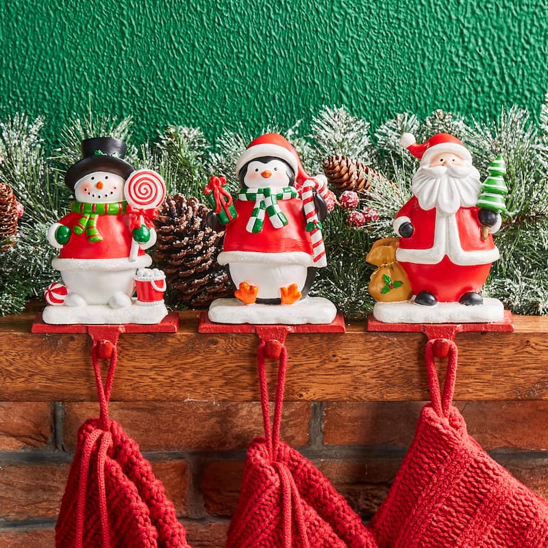 Glitzhome Resin Santa Snowman Penguin Gnomes with JOY Christmas Stocking Holders Mantel Ornament(Set of 3) - Santa, Snowman & Penguin