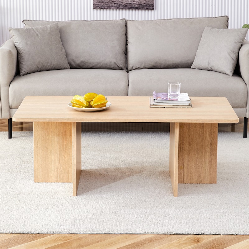 A modern and practical wood colored coffee table.The coffee table is made of medium density fiberboard material and is suitable