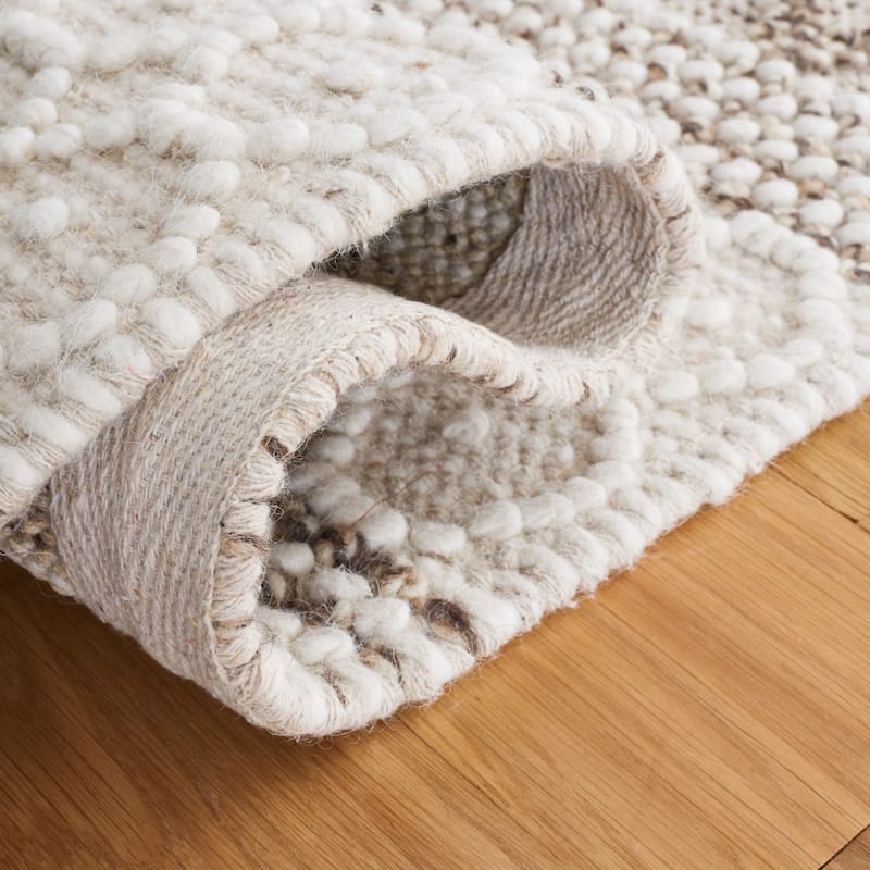 SAFAVIEH Handmade Natura Ifat Wool Braided Tassel Rug
