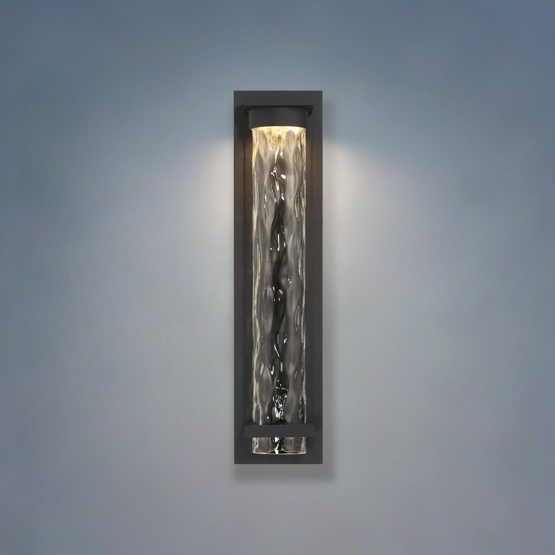 Thesis Lionel 20-inch Textured Black LED Exterior Wall Sconce with Clear Water Glass Shade