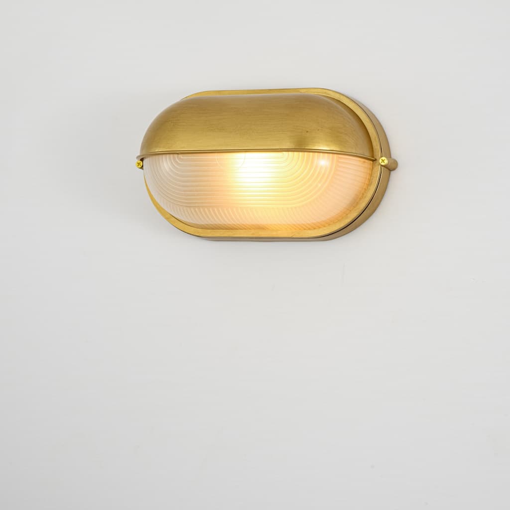 11"W 1-Light Retro 40W Oval Painted Gold Finish Wall Sconce with Clear Rippled Glass - 11.0 in. W x 6.3 in. H x 4.7 in. D