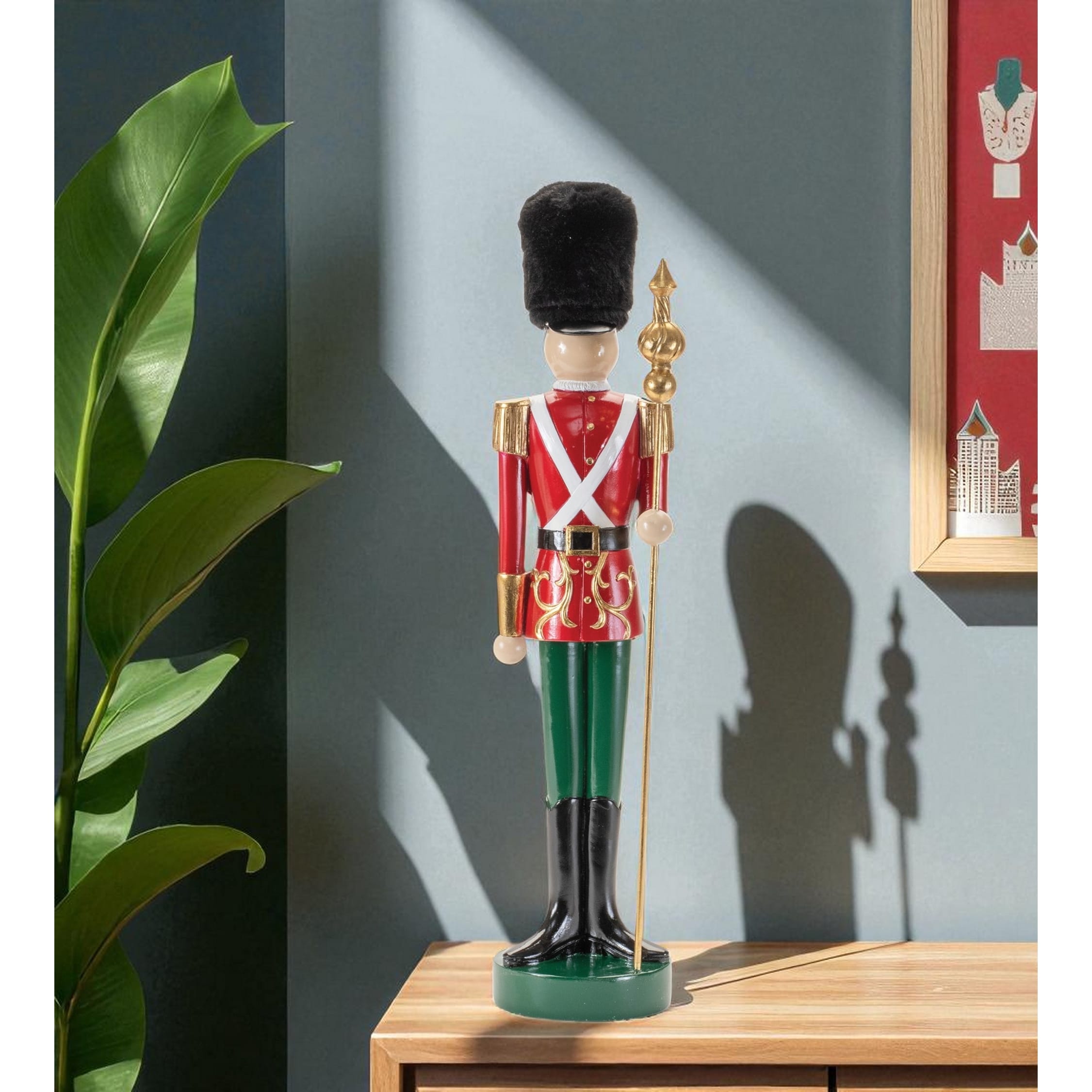 HomeRoots 19" Black Red And Green Resin Christmas Nutcracker Tabletop Sculpture - 4.75 in. x 19.00 in. x 4.00 in.