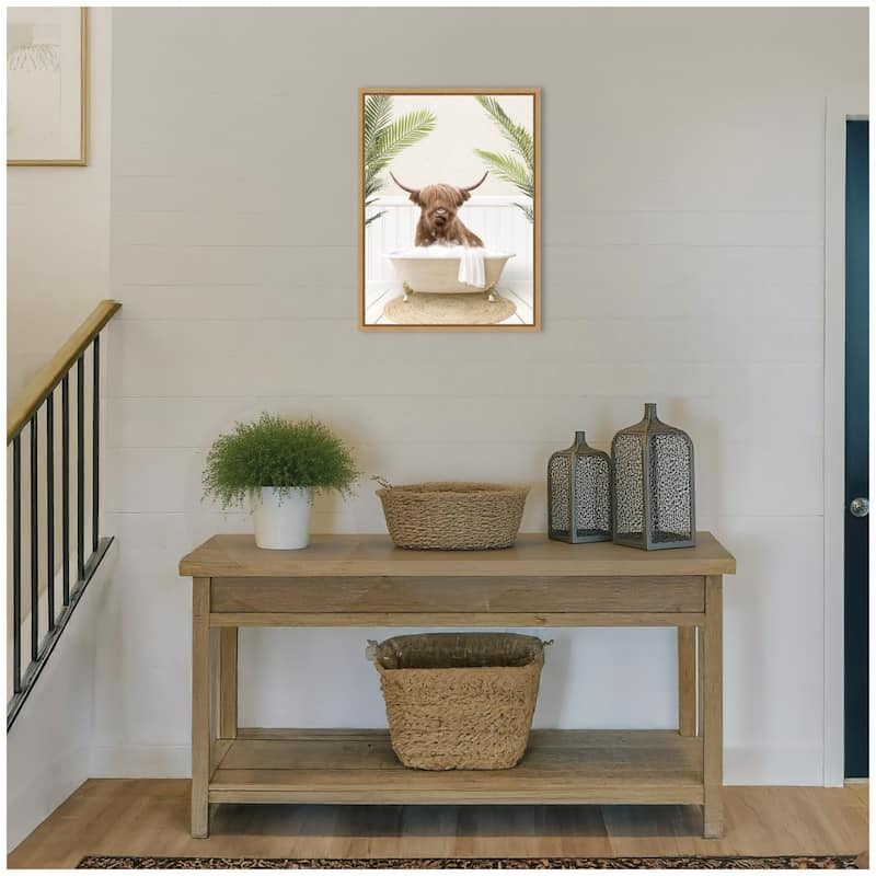 Kate and Laurel Sylvie Highland Cow in Palm Bathtub Framed Canvas by Amy Peterson