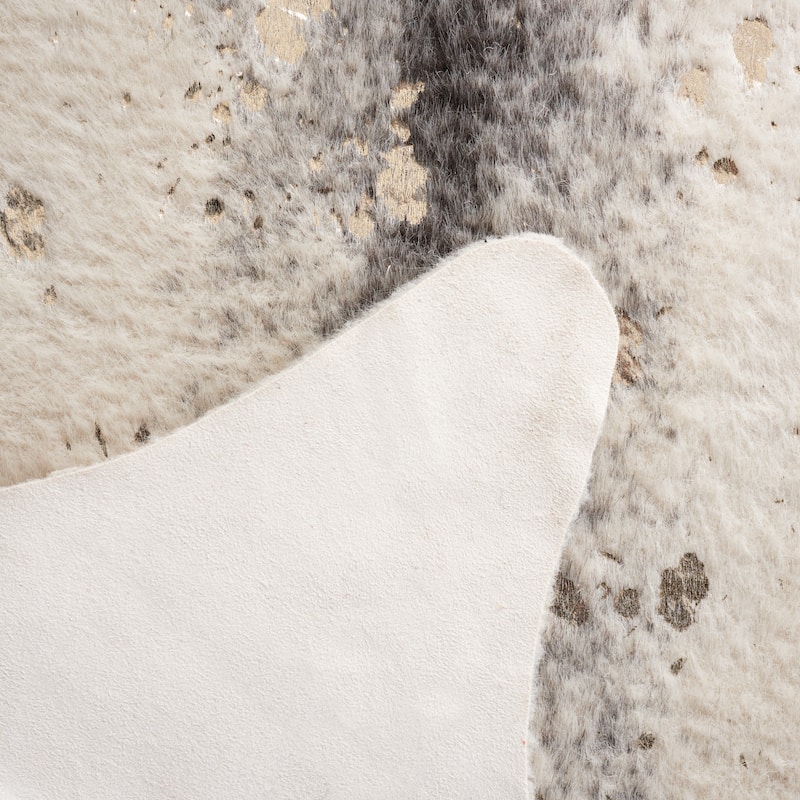 SAFAVIEH Faux Cow Hide Rassima Animal Rug