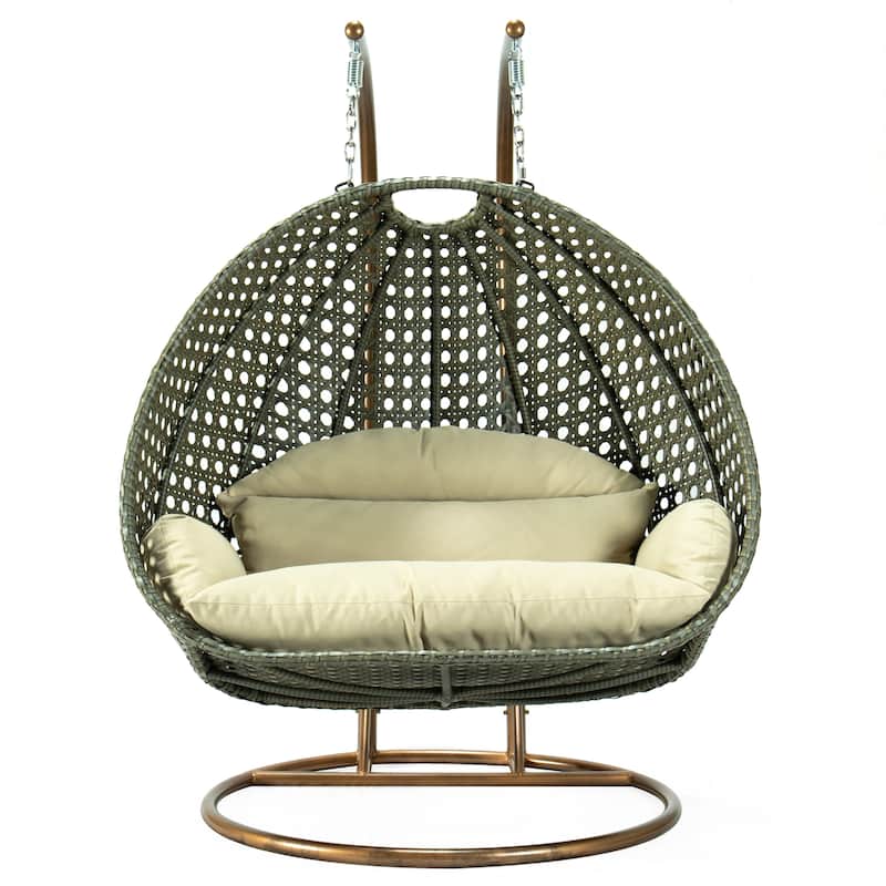 LeisureMod 2-Person Hanging Egg Swing Chair with Metal Stand - Handcrafted Beige Wicker, Patio Hammock Lounger with Cushions