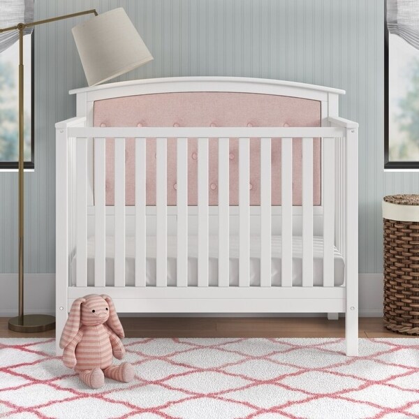 pink tufted crib
