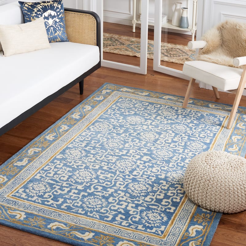 SAFAVIEH Handmade Antiquity Lauresha Wool Rug - 5' x 8' - Blue/Ivory