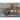 Signature Design by Ashley Breckington Brown Coffee Table - 50"W x 26"D x 18"H