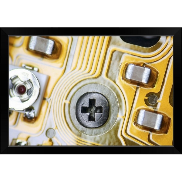 "Screw in computer circuit board" Black Framed Print