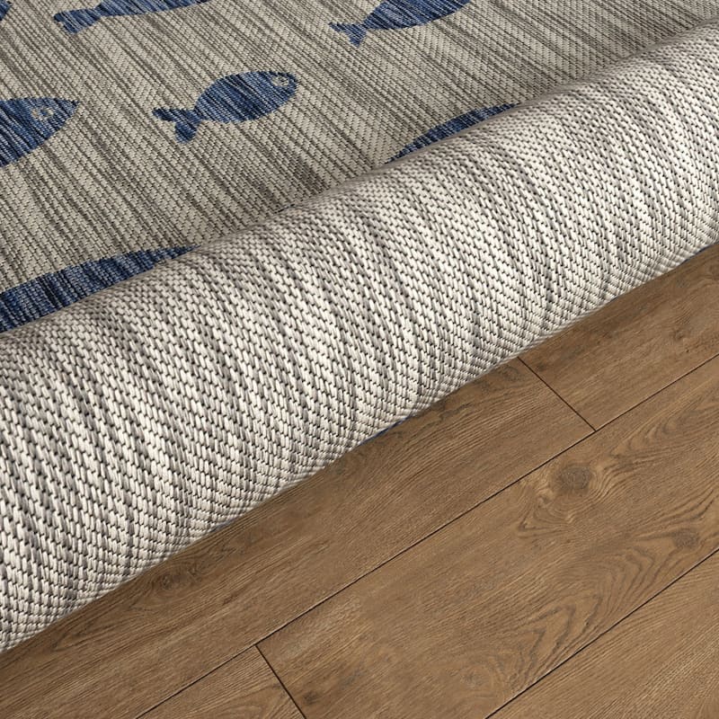 Isola Tropical Indoor/Outdoor Area Rug by Porch & Den