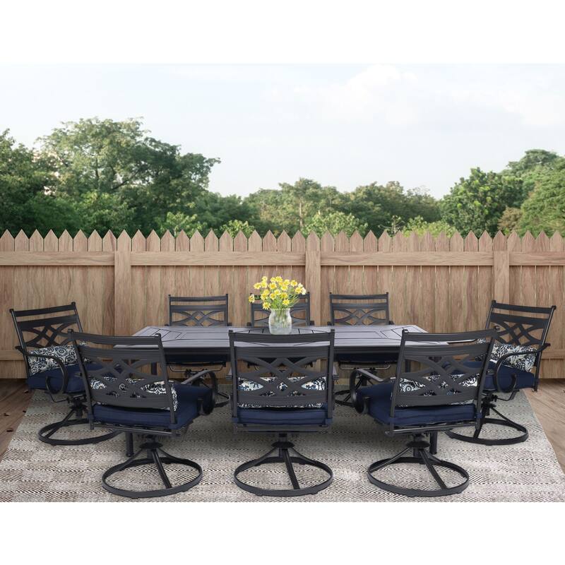 Hanover Montclair 9-Piece Dining Set in Navy Blue with 8 Swivel Rockers and a 42-In. x 84-In. Table