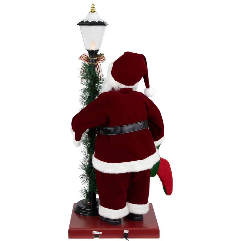 Animated and Musical Santa Claus Figure with Lighted Lamppost and Christmas Stocking - 31"