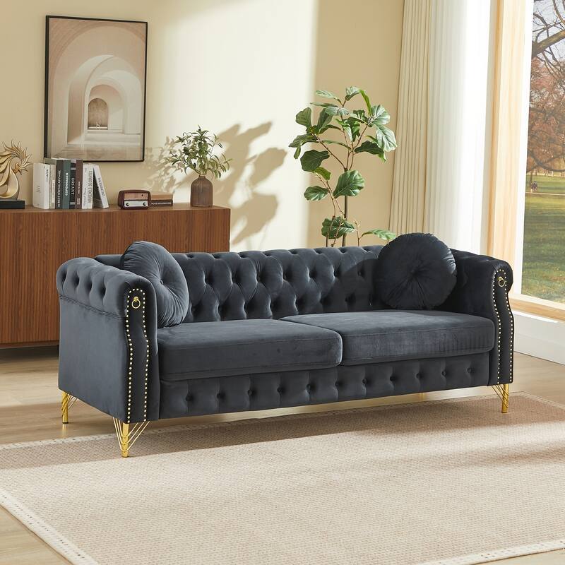 Chesterfield Sofa with Two Round Pillows, Featuring Copper Stud Detailing and Tufted Button Accents