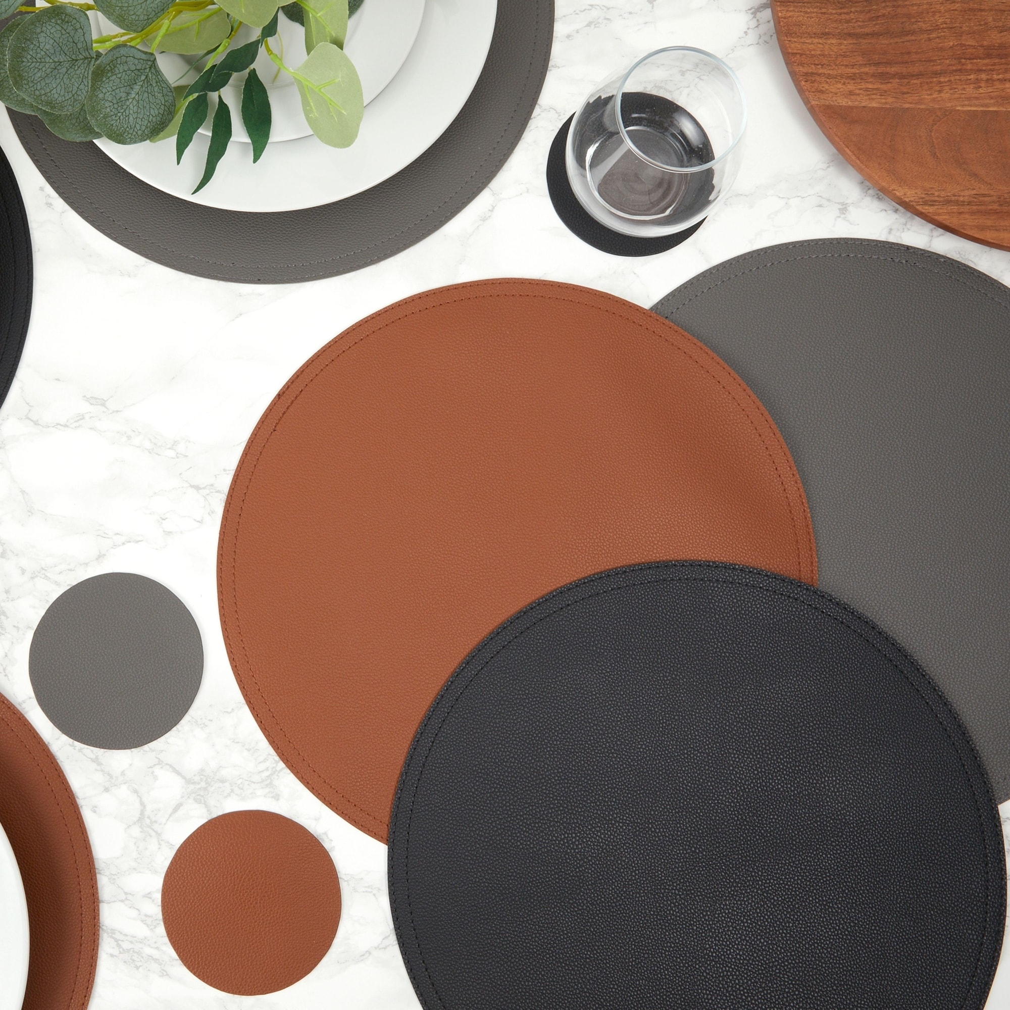 https://ak1.ostkcdn.com/images/products/is/images/direct/18b971249a1445da49c3a147f18be28d34fd9c4b/Set-of-6-Faux-Leather-Circle-Placemats-and-6-Round-Coasters-for-Dining-Room-Table-%28Dark-Grey%29.jpg