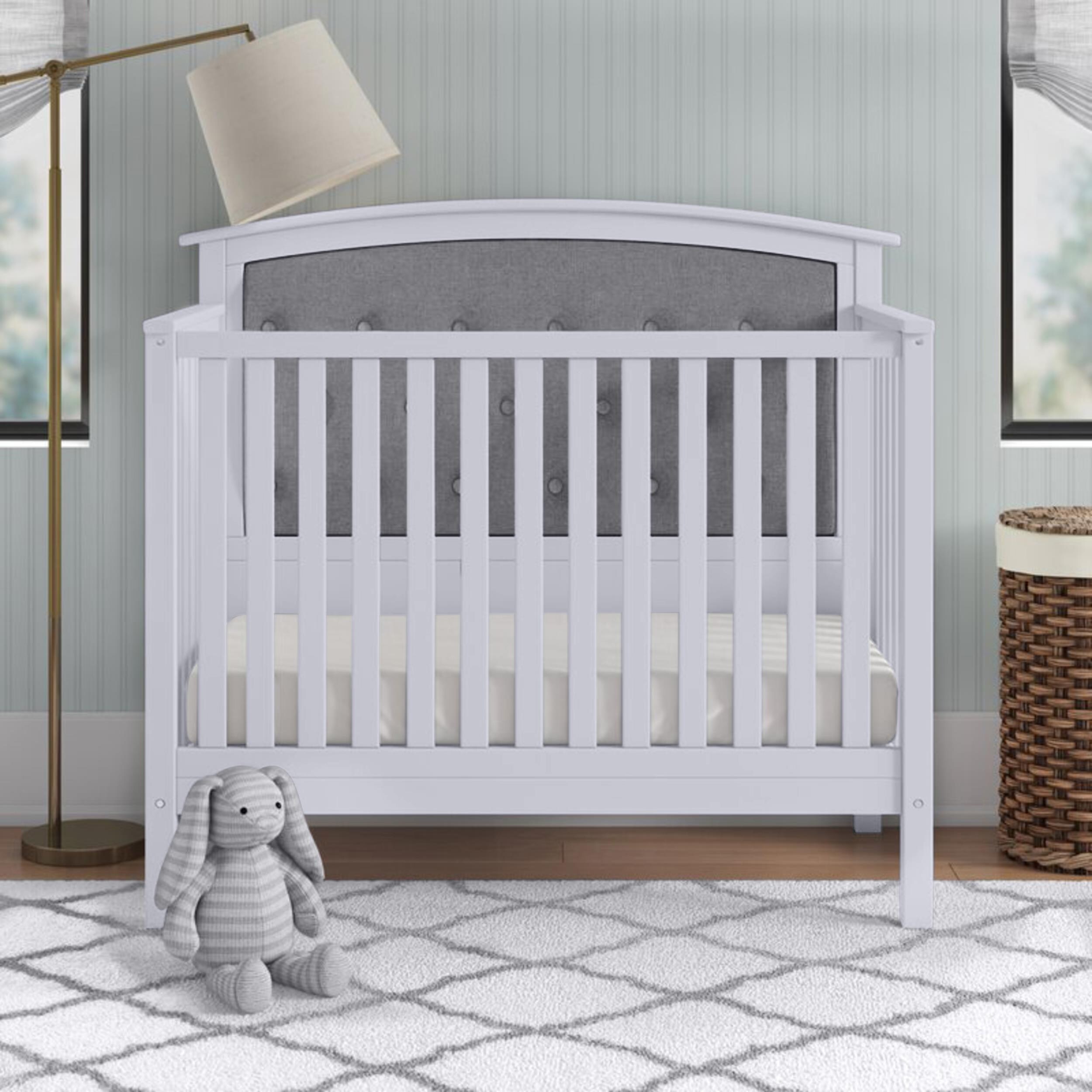 grey tufted crib