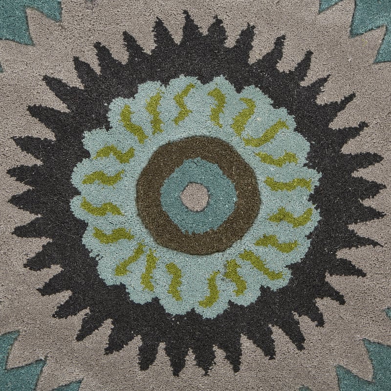 Sevita Bursting Peacock Wool Area Rug