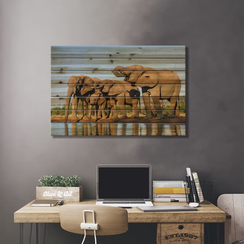 View of Elephant family at water hole, Botswana, Africa Print On Wood by Panoramic Images - Multi-Color