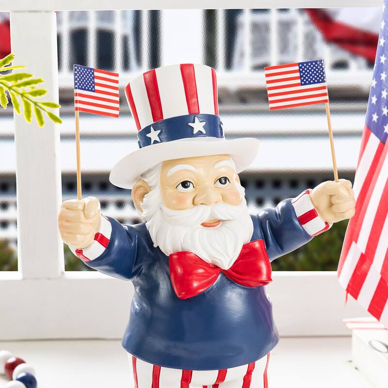 Glitzhome 9"H Patriotic/ Americana Polyresin Santa Holding Flags Table Decor