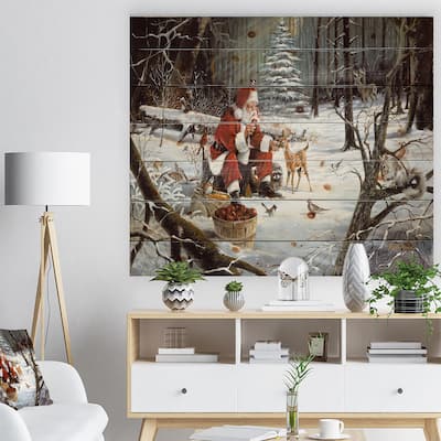 Designart 'Santa Claus with deer in snowy woods' Print on Natural Pine Wood - White
