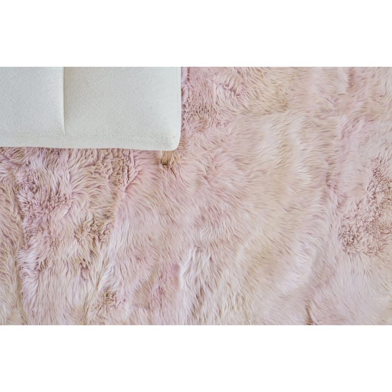 EXQUISITE RUGS Sheepskin Hand-stitched Blush Area Rug.
