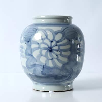 Approx. 10 Inches Tall Blue and White Vase with Flower Motif