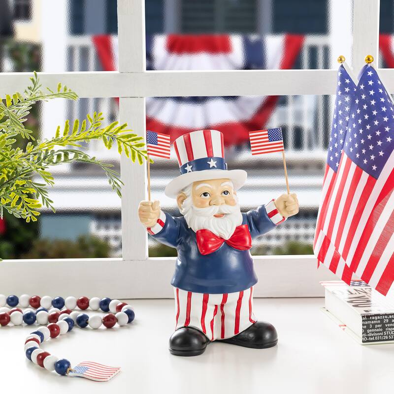 Glitzhome 9"H Patriotic/ Americana Polyresin Santa Holding Flags Table Decor